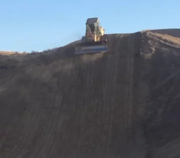 Loader on dirt hill