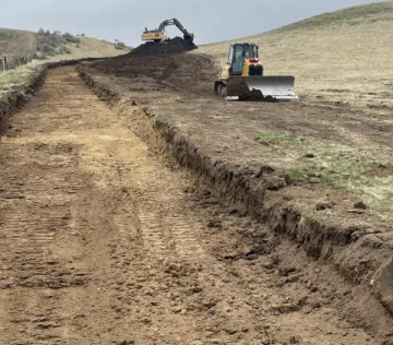 Loader and excavator working job site