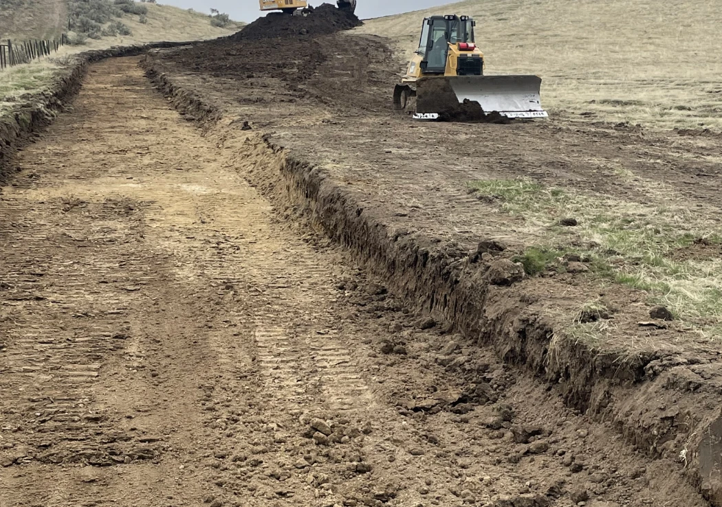 Track Loader working land on construction site