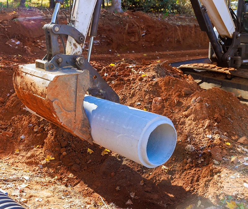 heavy equipment installing a gravity fed irrigation system