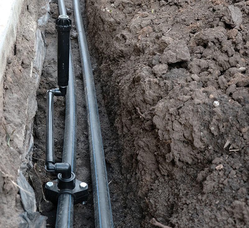 pressurized irrigation system in open trench